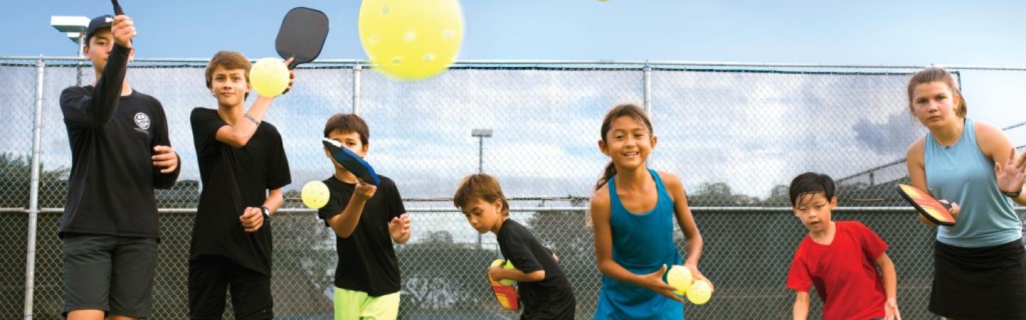 kids playing pickleball